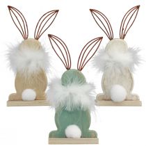 Artikel Dekorativa kaniner i trä med fjädrar Påskdekoration H17,5 cm 3 st