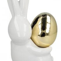 Påskharar eleganta, keramiska kaniner med guldägg, påskdekoration vit, gyllene H18cm 2st