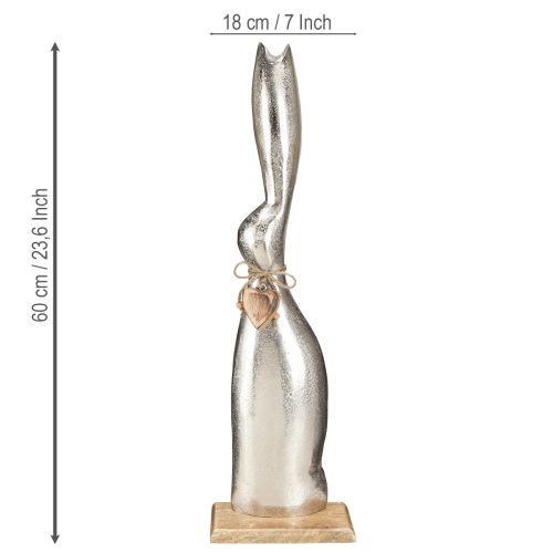 Artikel Dekorativt kaninsilver på träbotten – Elegant påskfigur med hjärthänge H60cm