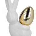 Floristik24 Kaniner med guldägg, keramiska kaniner till påsk ädelvit, gyllene H13cm 2st