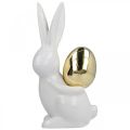 Floristik24 Påskharar eleganta, keramiska kaniner med guldägg, påskdekoration vit, gyllene H18cm 2st